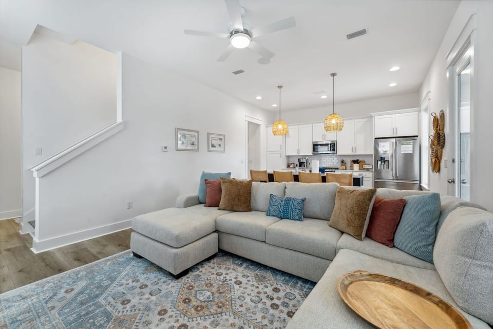 Beach house living room complete with large sectional sofa.