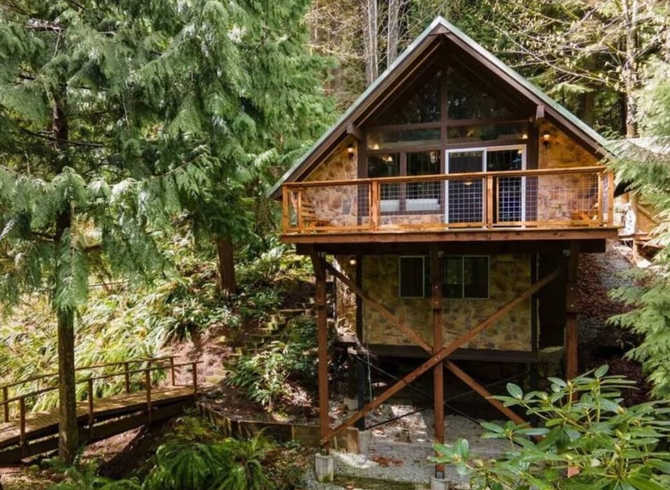 Front view of the Alpine Chalet, showcasing the quaint bridge to cross to enter.