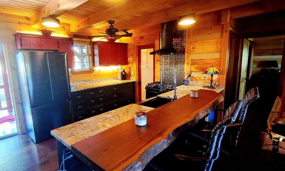 Custom crafted! Sit at teak live edge bar and table while someone else cooks :)