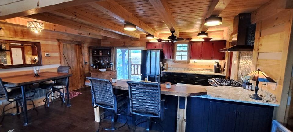 custom crafted kitchen with live edge teak counter tops and table ! seats 6 