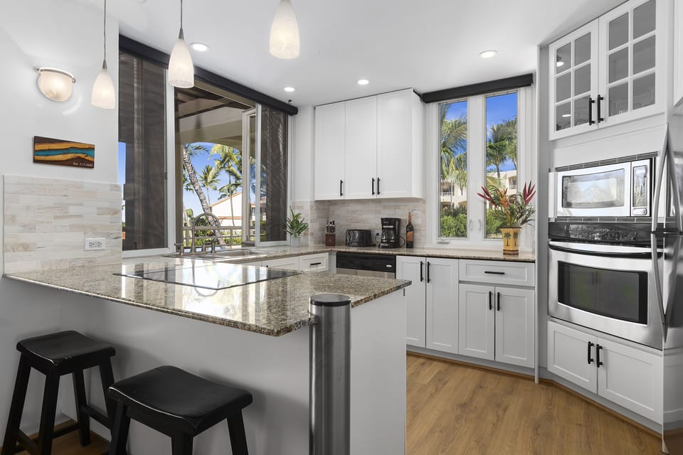 Sunny kitchen with pass through window to the lanai