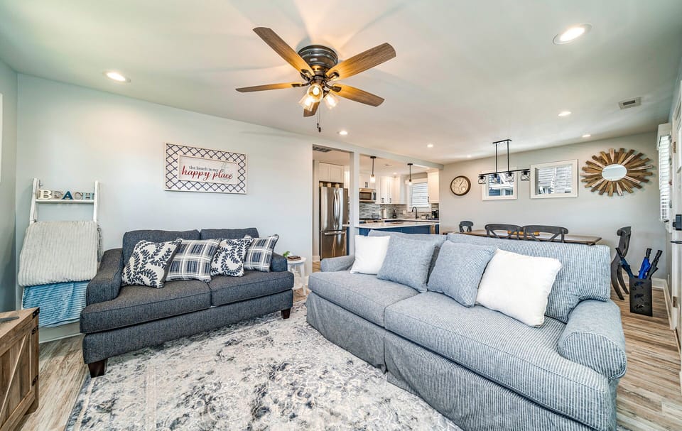 Coastal living room with plush seating and natural light