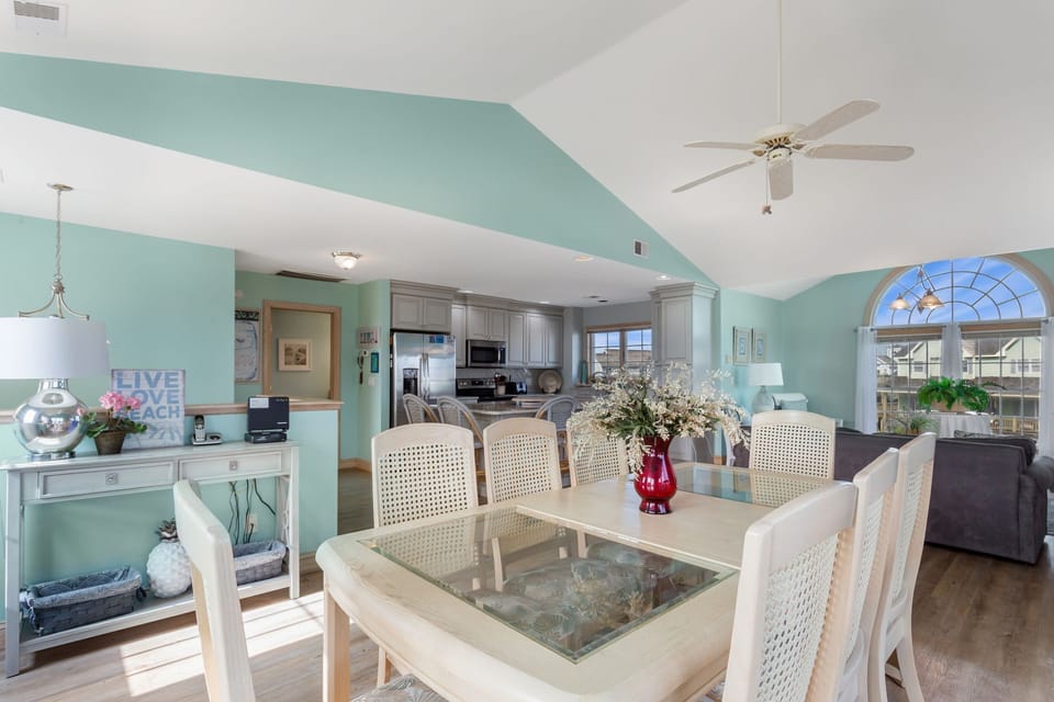 The open-concept Dining Area with seating for 8 ensures fun conversation and lots of sunlight as everyone eats together.