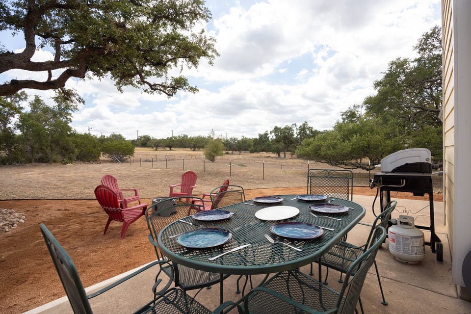 Patio with outdoor dining and a gas BBQ