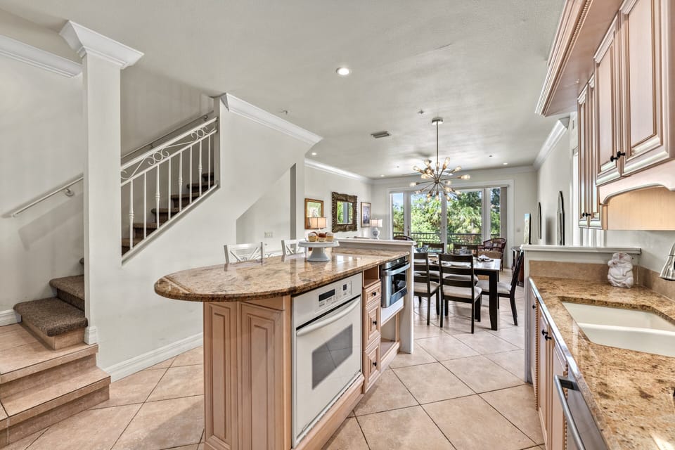 The kitchen center island with staircase to the third floor.