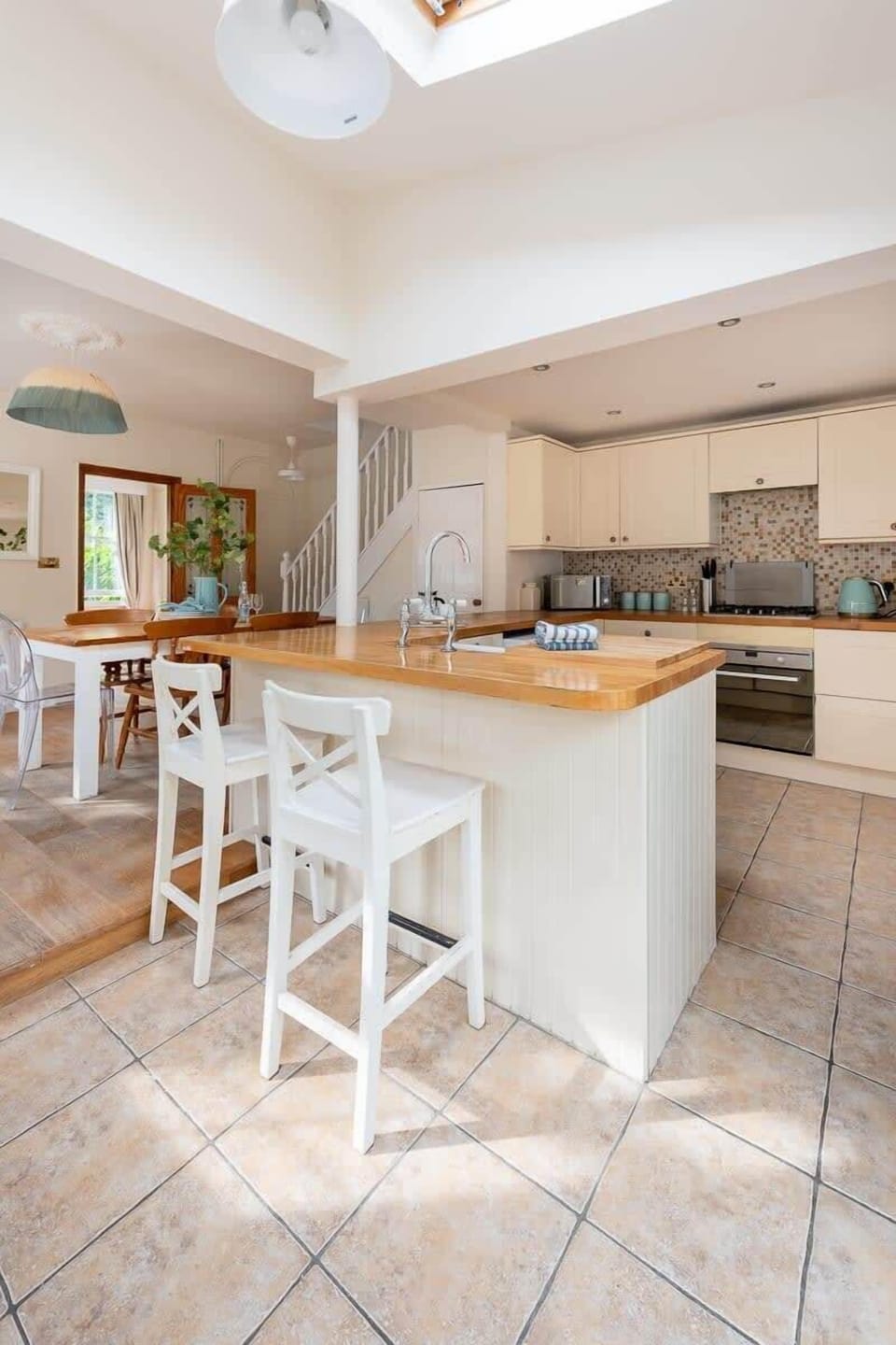 Bar stools provided for the kitchen counter
