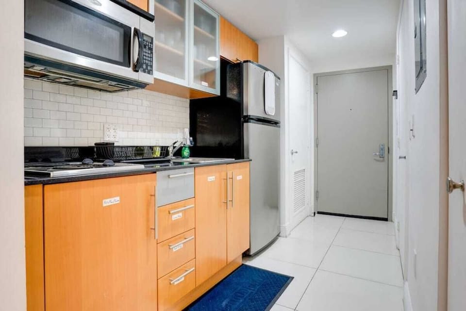 Fully equipped kitchen with complete set of cookware.
