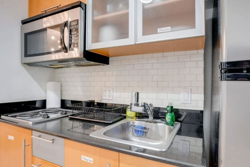 Fully equipped kitchen with complete set of cookware.