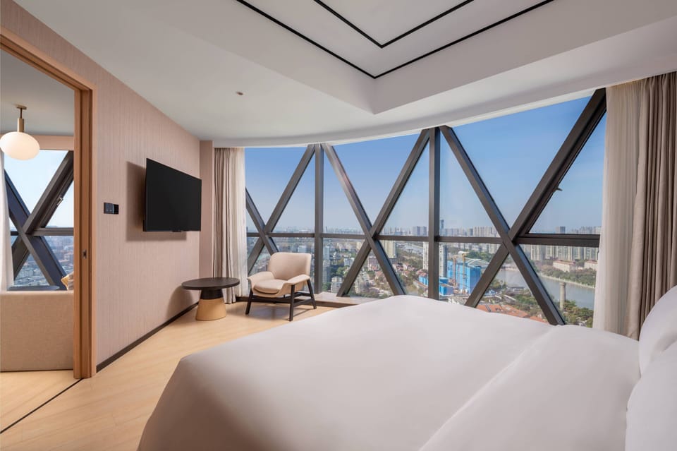 Deluxe Suite, 1 King Bed | Premium bedding, down comforters, minibar (free items), in-room safe