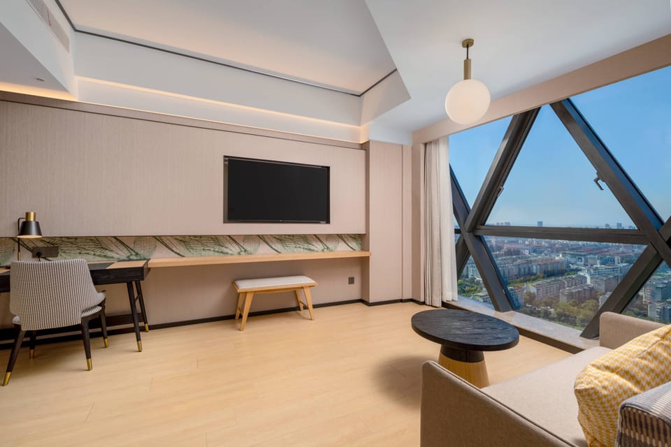 Deluxe Suite, 1 King Bed | Premium bedding, down comforters, minibar (free items), in-room safe