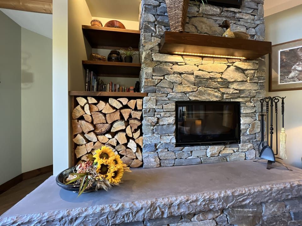 A wood-burning fireplace on the main level makes for some very cozy evenings. Split firewood is provided. 