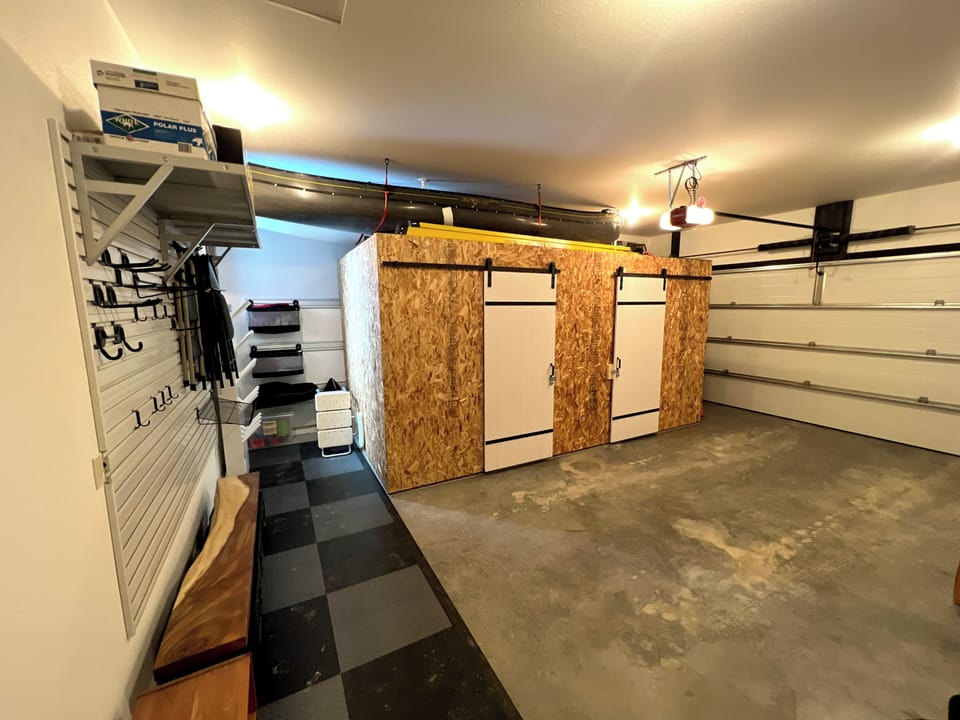 The garage is a great space to dry and store gear. In winter there is a commercial boot/glove dryer, so no one's putting on cold boots in the morning—also room for one vehicle inside.