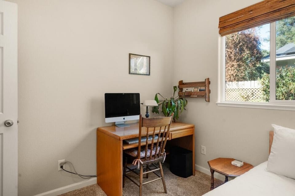 Computer monitor & keyboard provided in one of the bedrooms, perfect for remote work