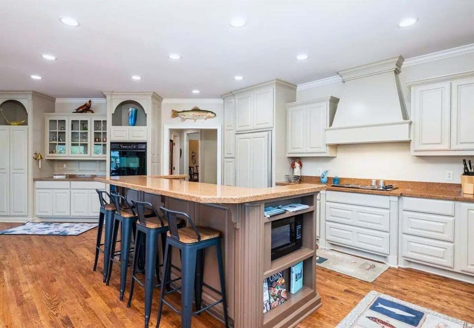 [Kitchen] The Kitchen Has Stainless Steel Appliances, a Large Refrigerator, Cooking Basics, Dishes and Much More.