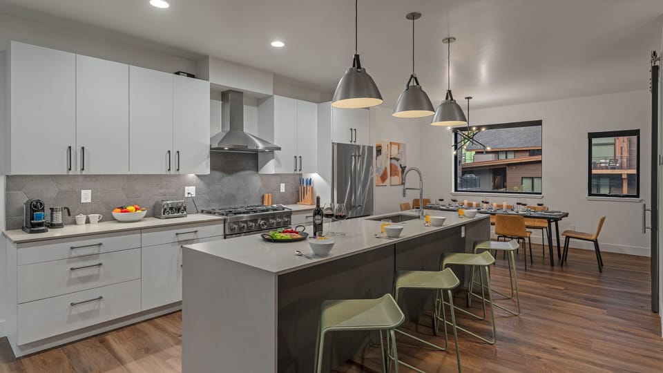 Kitchen, Main Level - With breakfast bar seating
