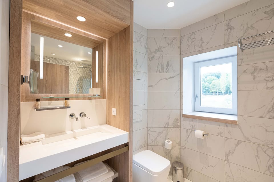 Superior Room | Bathroom | Hair dryer, bathrobes, slippers, towels