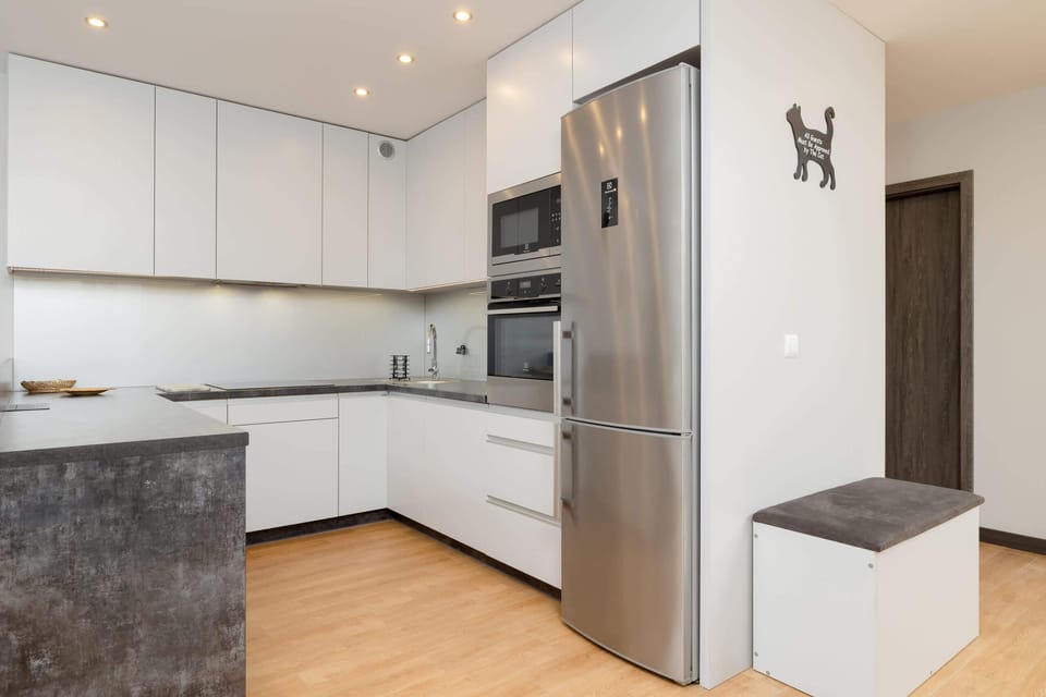 A practical kitchenette, equipped with the necessary appliances.