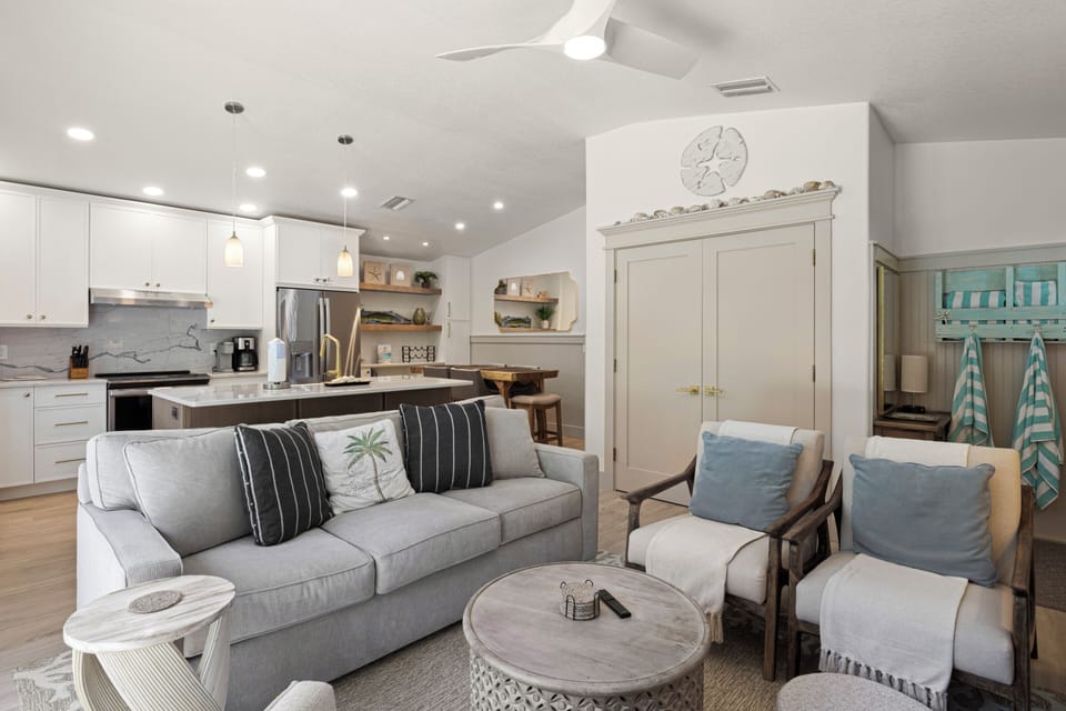 Relax in your beautifully designed open-concept space where coastal charm meets modern comfort, complete with a fully equipped kitchen.