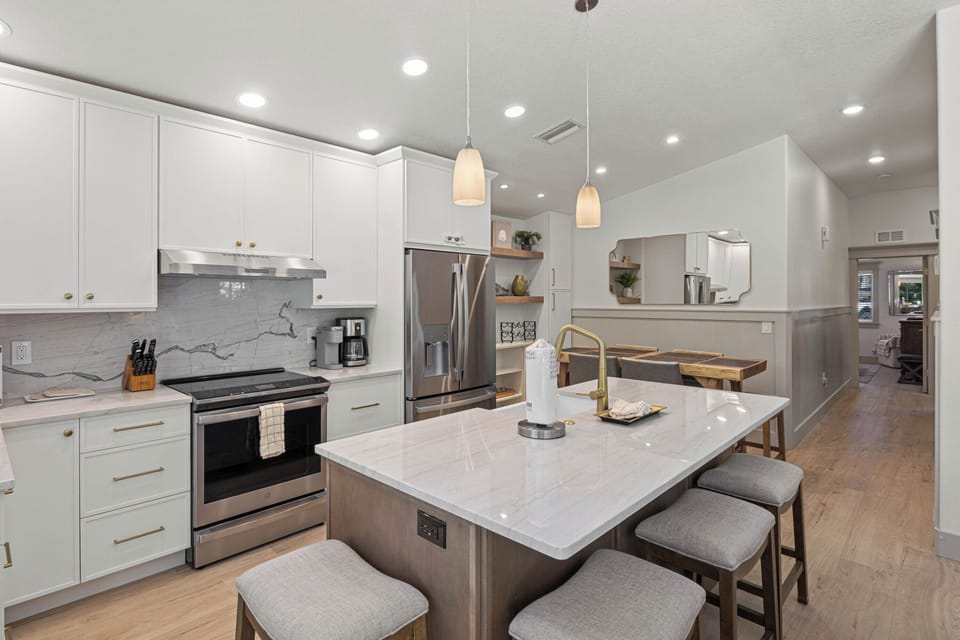 Your modern kitchen awaits with gleaming quartz countertops, stainless steel appliances, and a spacious island perfect for cooking memorable meals together.