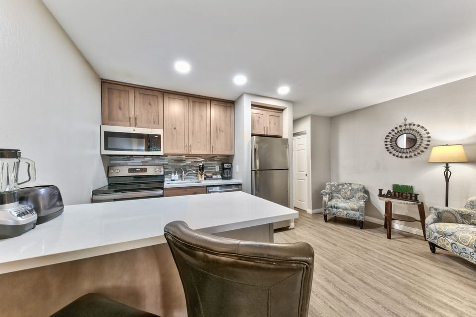 Your open-concept kitchen flows seamlessly into the living area, creating the perfect space for cooking and relaxing together.