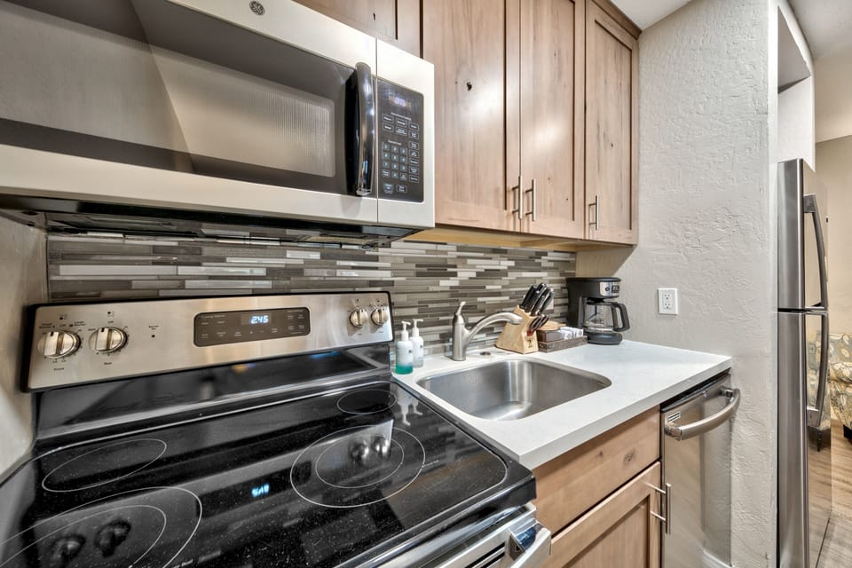 Your fully equipped kitchen features stainless steel appliances, modern cabinetry, and everything you need for home cooking.
