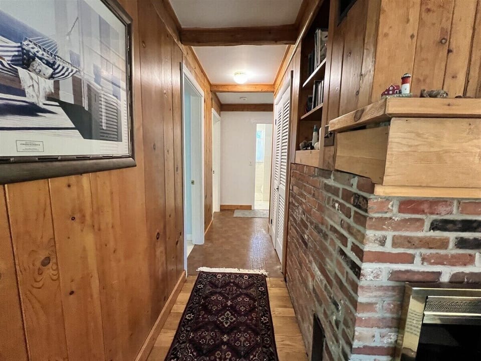 Hallway off the livingroom which leads to the three bedrooms