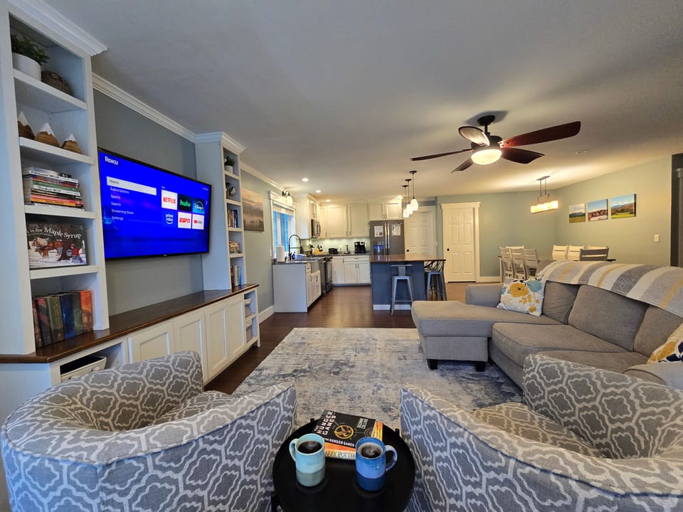 The open concept kitchen, living and dining space allows you and your family to 