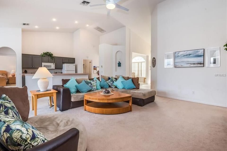 Inviting living room with modern decor, plush seating, and an open layout.