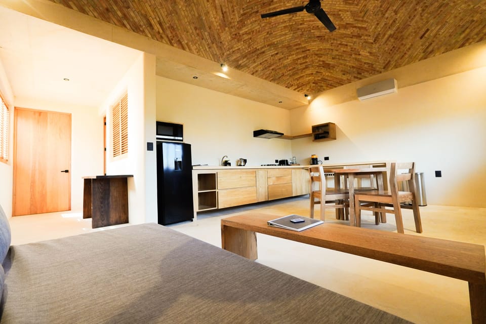 Deluxe Apartment, Bathtub, Partial Ocean View | Living area | 50-inch Smart TV with satellite channels, Netflix, books