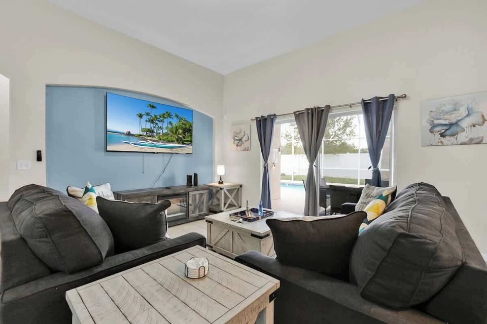 Relax and savor a cozy moment on the couch with a warm beverage, the coffee table at your fingertips.