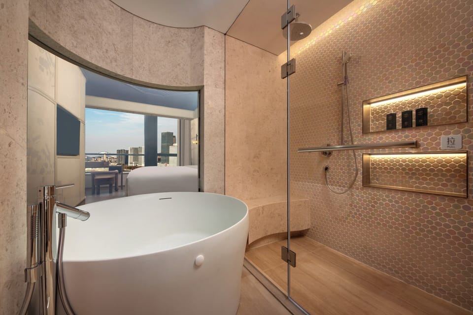 Suite, 1 Bedroom | Bathroom | Separate tub and shower, hydromassage showerhead, designer toiletries