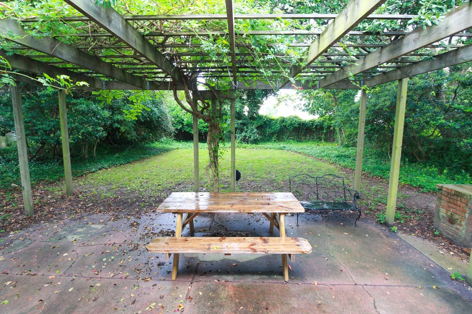 Spacious backyard with picnic table