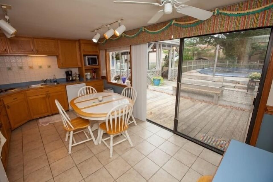 Kitchen with access to deck and pool
