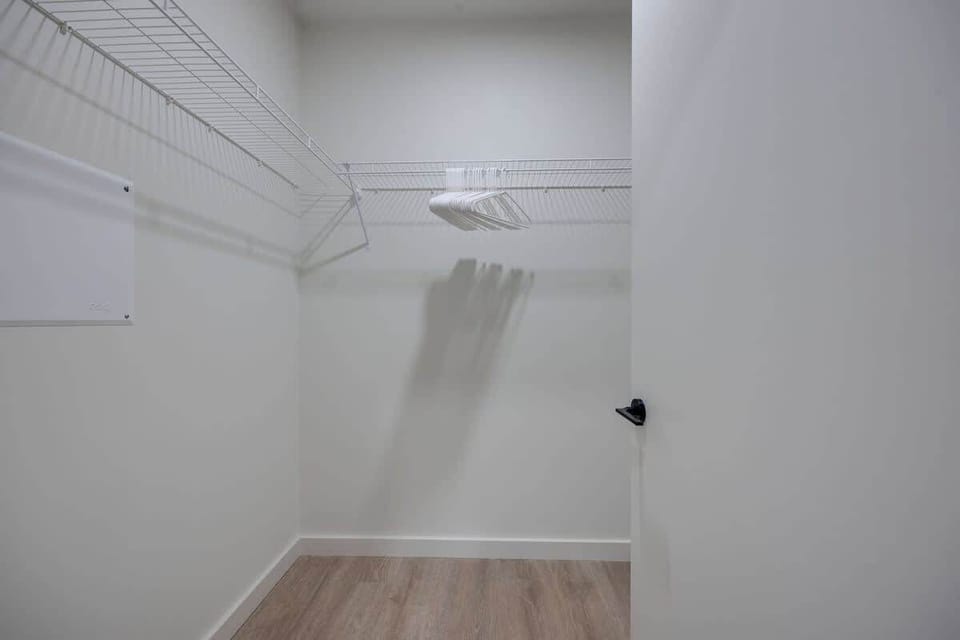 Primary bedroom's large walk-in closet
