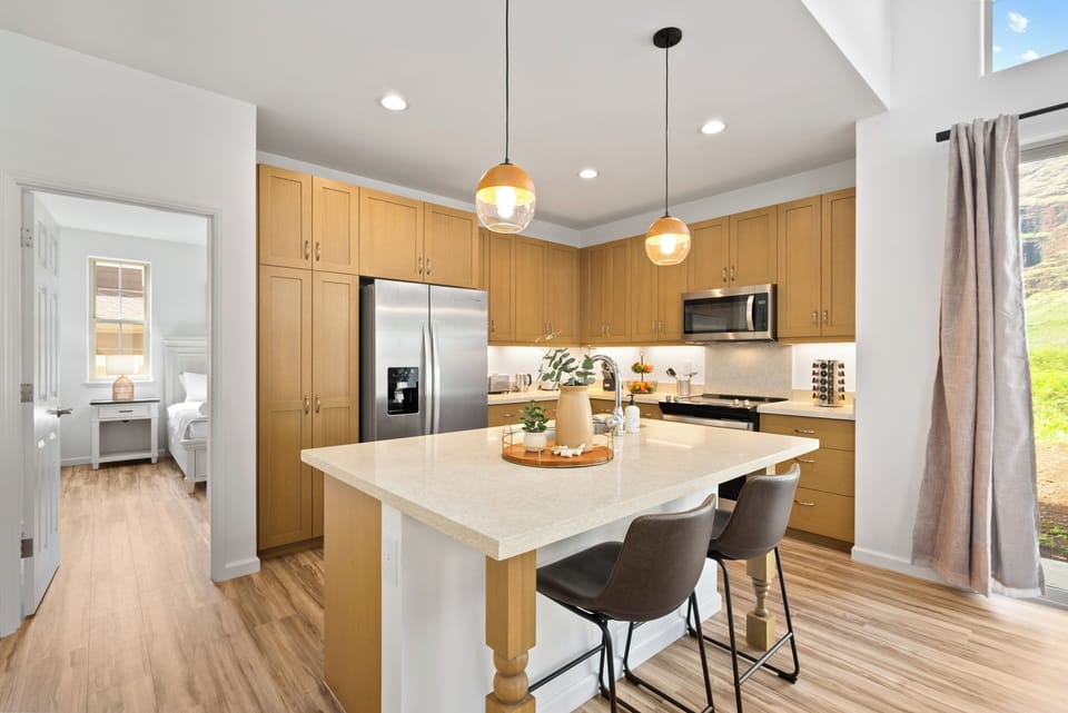 Fully equipped kitchen with barstool seating.