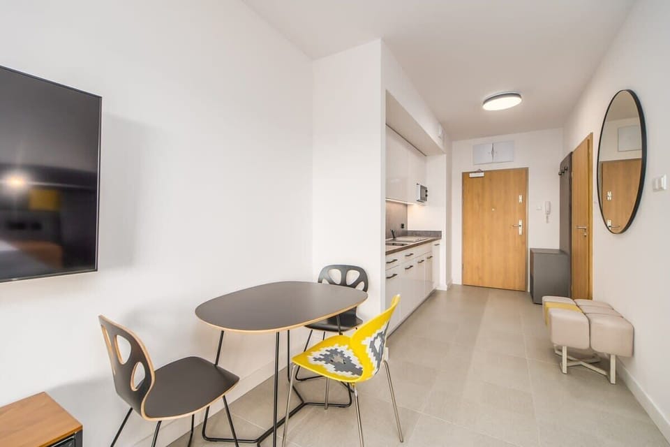 Large table with chairs for eating communal meals. 