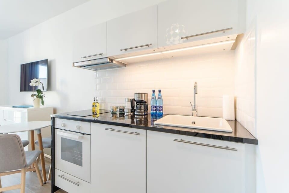 The fully equipped kitchenette includes everything you need for a home-cooked meal.
