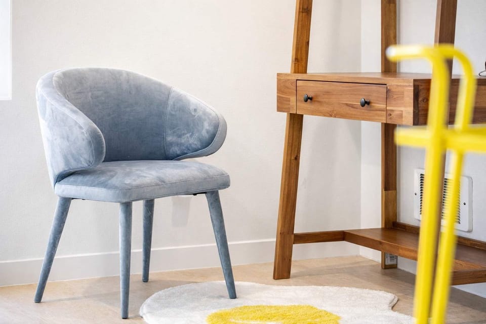 A charming corner with a desk and comfortable chair - perfect for working or relaxing.