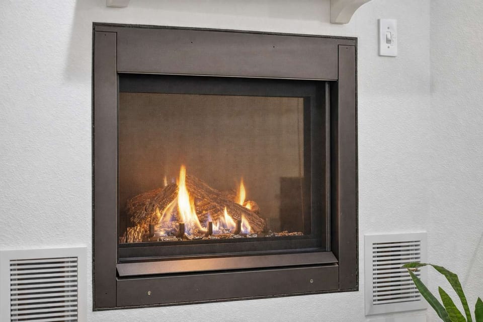 Decorative fireplace adding a cozy design touch.