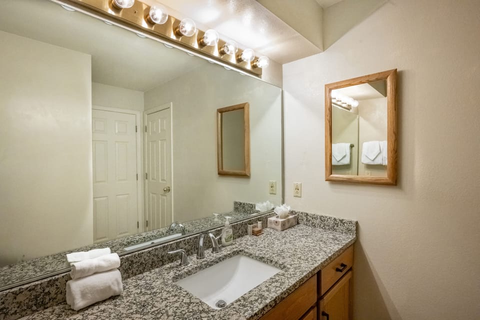 Granite in bathroom. Separate sink area