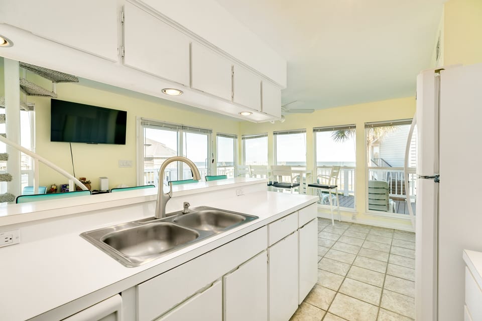 Watch tv or get a glimpse of the waves while preparing meals