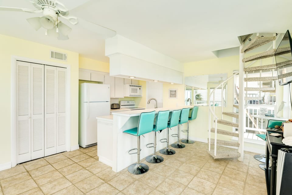 Grab a quick snack or enjoy meals at the breakfast bar seating 5