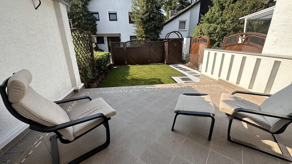 Private backyard with seating options to relax