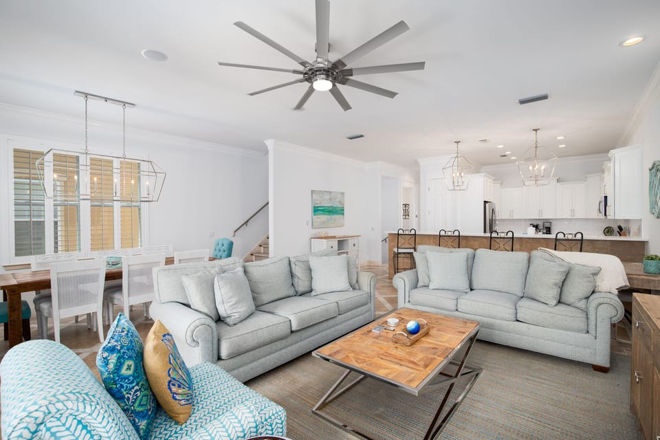 Unwind in your bright, airy living space featuring plush seating and an open layout connecting to your fully-equipped kitchen.