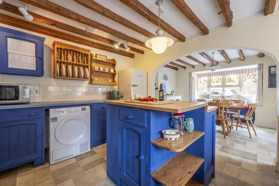 Ground floor: Kitchen with island and dining area at the far end