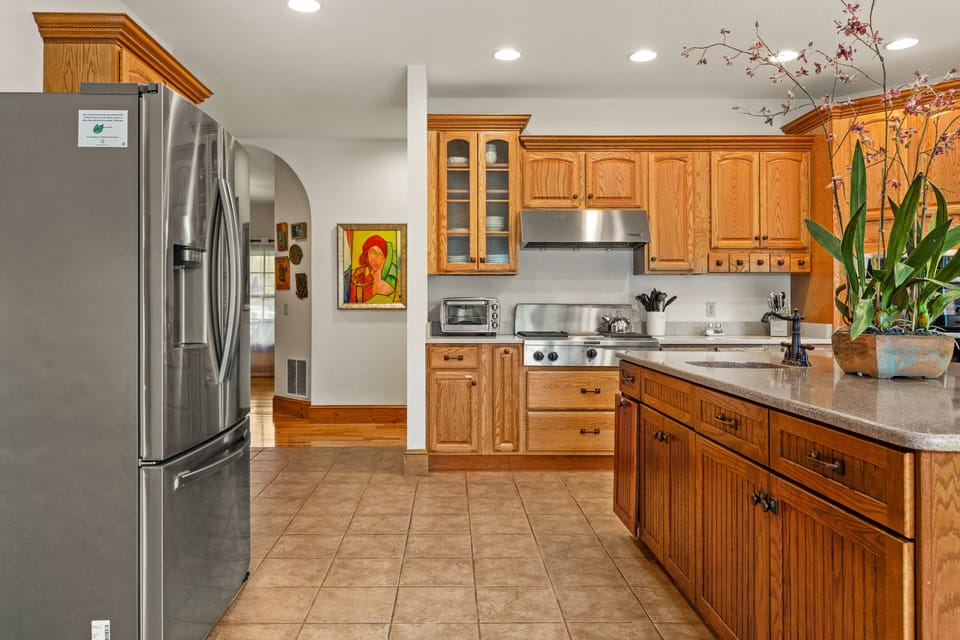Large kitchen with a gas stove, and lots of counter space and fully stocked.