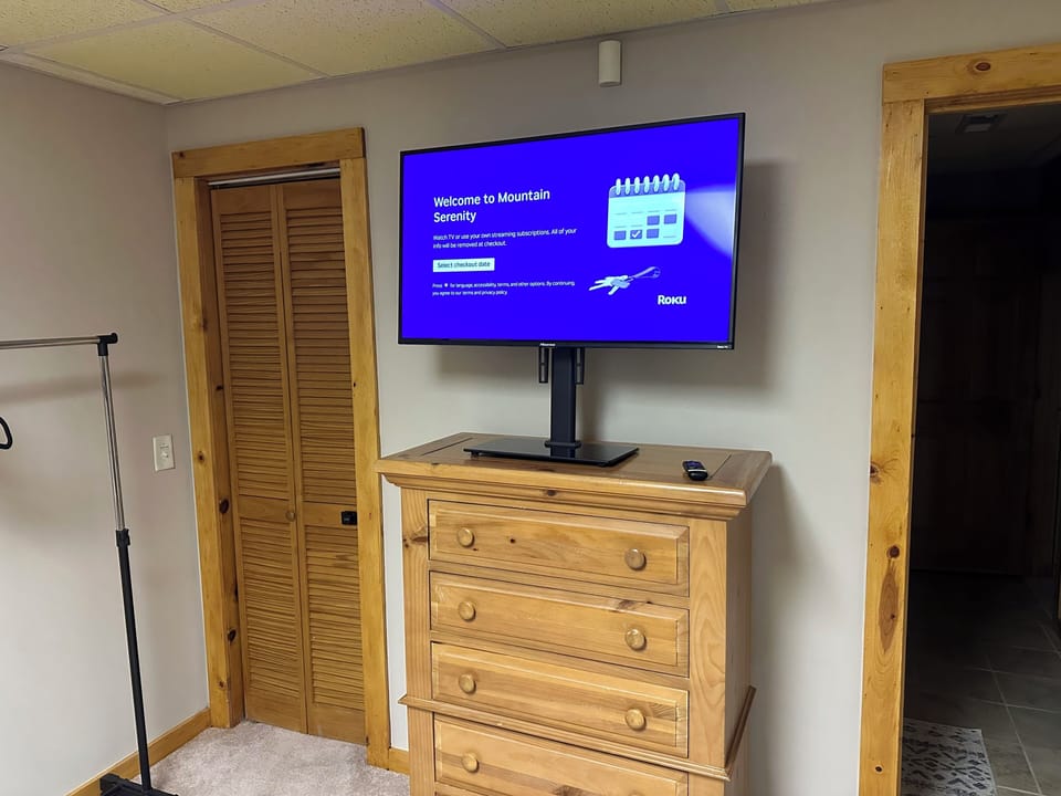Downstairs bedroom with two bunk beds and Roku TV—perfect for kids or groups.