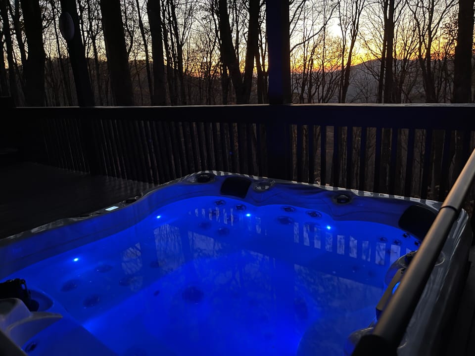 Soak in the private hot tub as the sun sets over the Blue Ridge.
