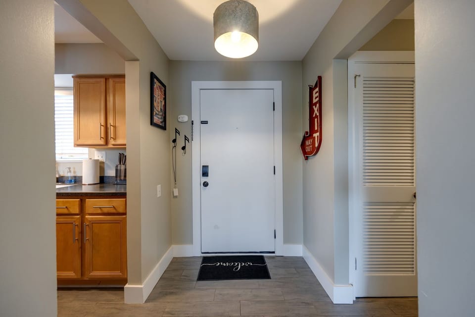 Make your way down this hallway and discover a charming kitchen space filled with the aroma of home-cooked meals.