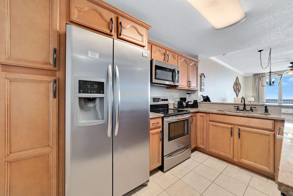 Modern kitchen essentials at your fingertips. This countertop setup offers everything you need for a quick breakfast or a relaxing cup of coffee.